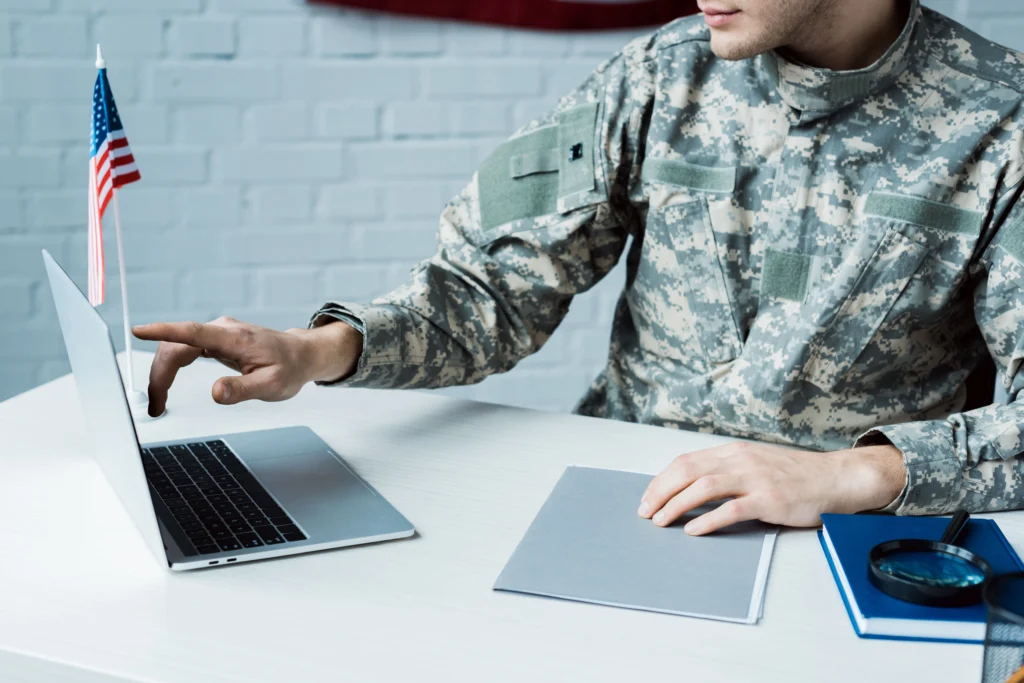 Veteran applying for disability claim using his laptop