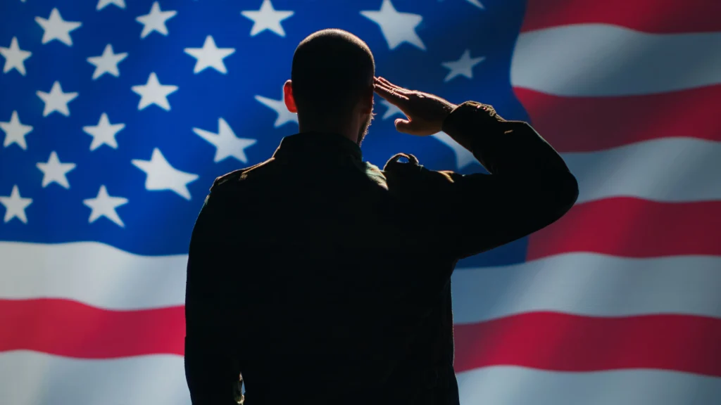 Veteran Soldier serving in United States Armed Forces doing patriotic gesturing 